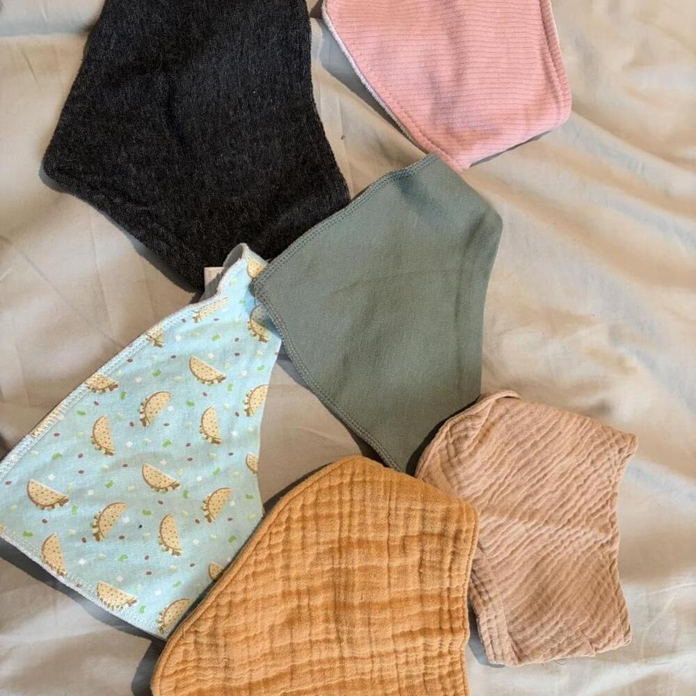 Multi-colored baby bibs with hedgehog print